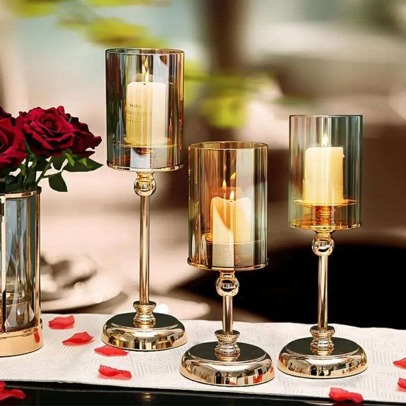 Set of three metallic candle holder